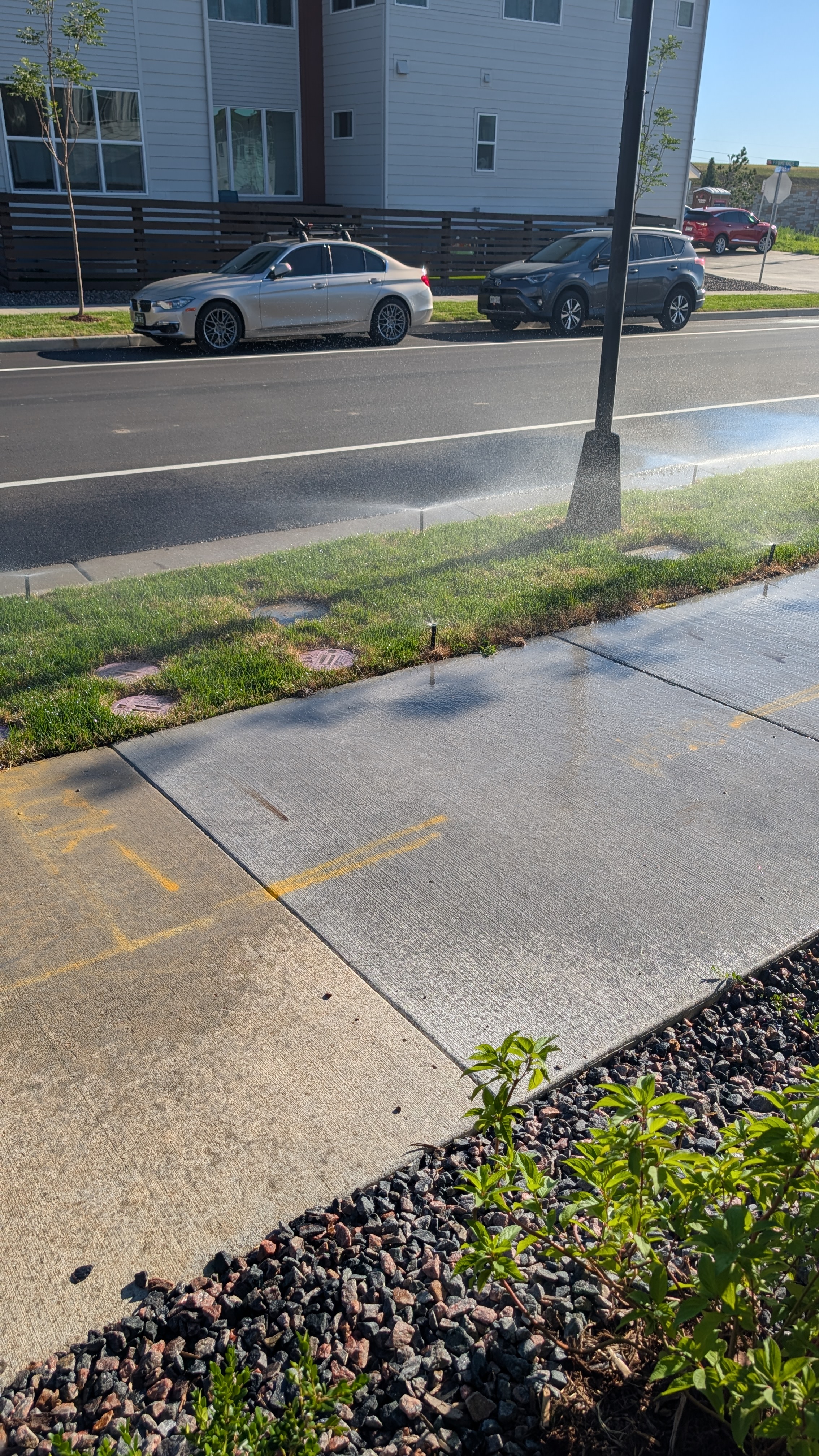 I can't even step outside without getting soaked. Simple to fix - lower sprinkler heads, lower volume or DRIP IRRIGATION or XERISCAPE.